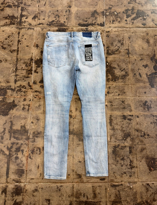 KSUBI RIPPED BLUE JEANS