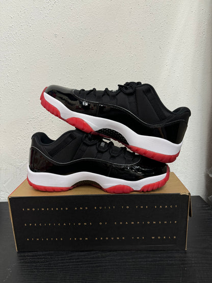 JORDAN 11 LOW BRED